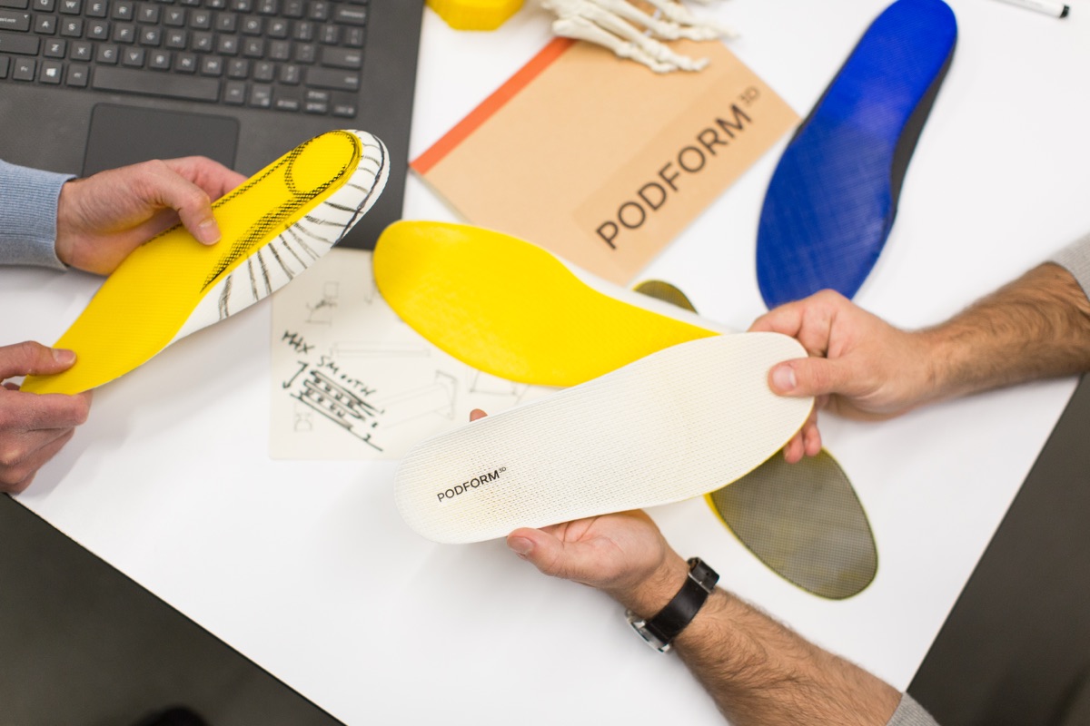 Collection of custom 3D-printed orthotic insoles showing a range of designs and configurations