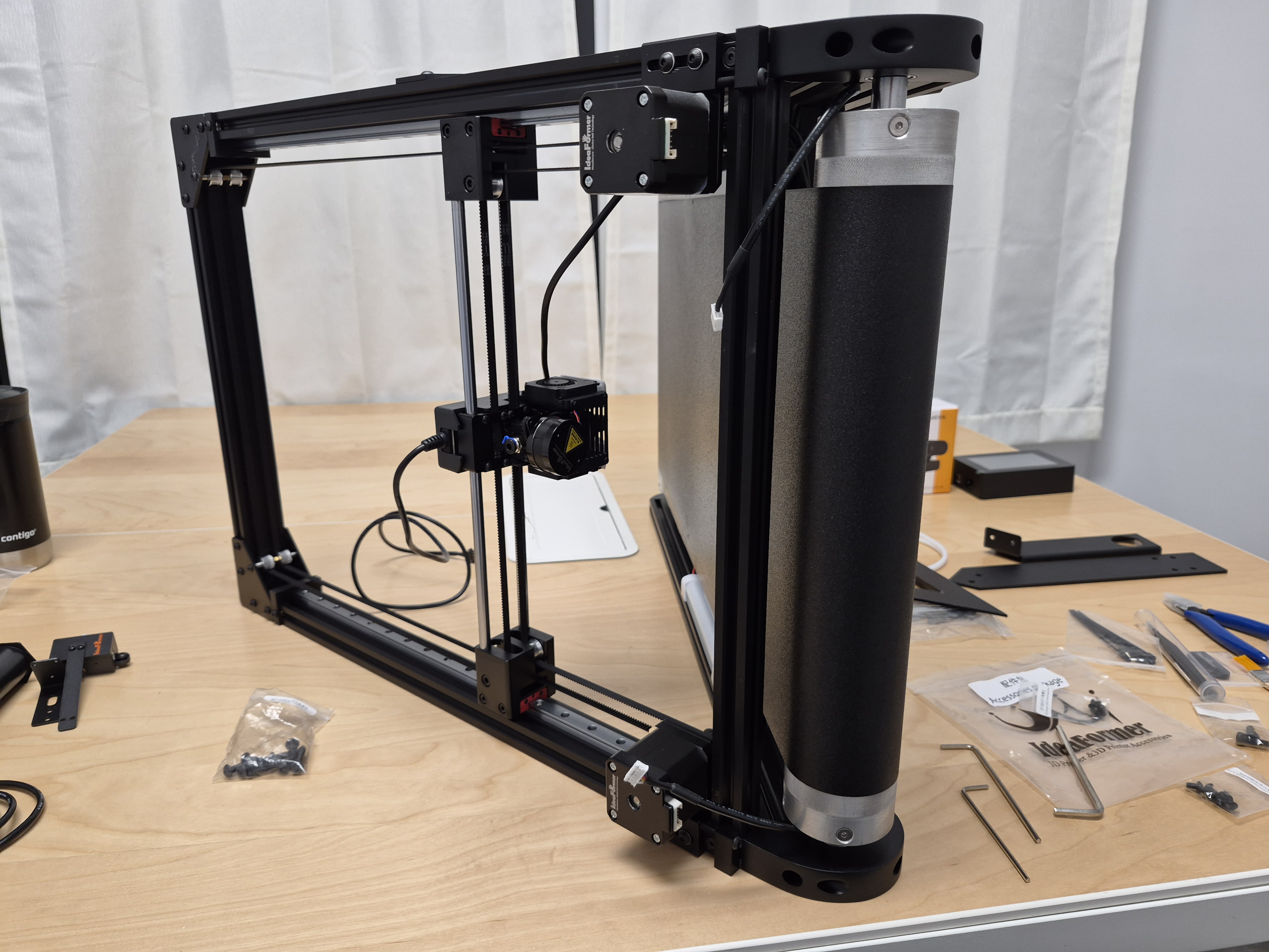 Wide real-world frame reference with the printer resting flat on the table